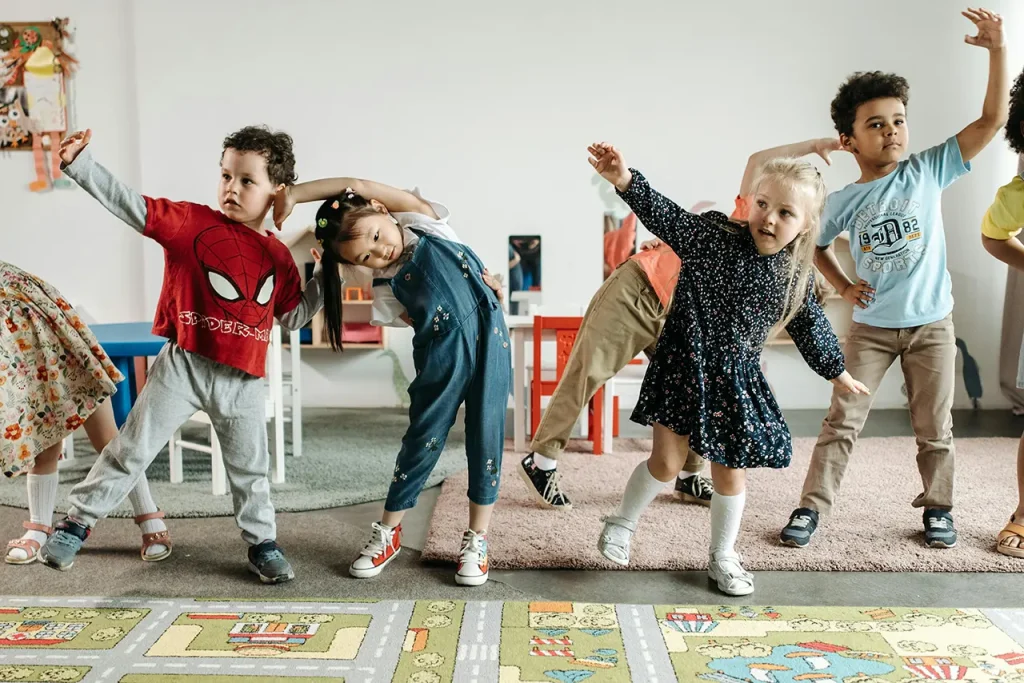 preschool kids stretching in classroom