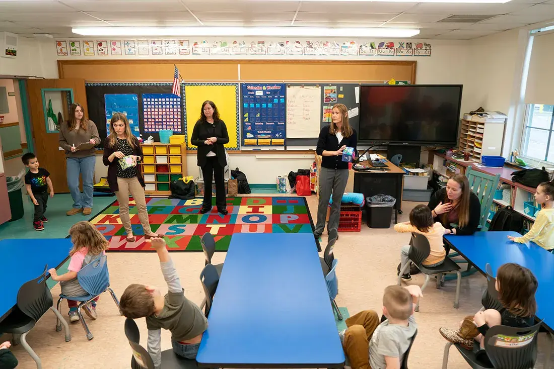 educators working with children in a classroom